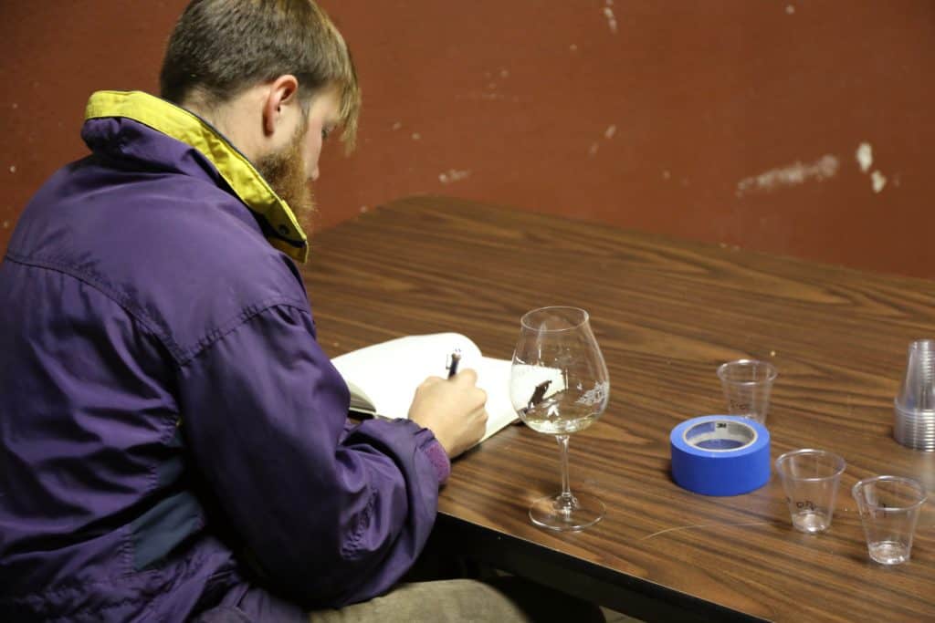 Alex Fullerton taking notes during blending trials at Fullerton Wines