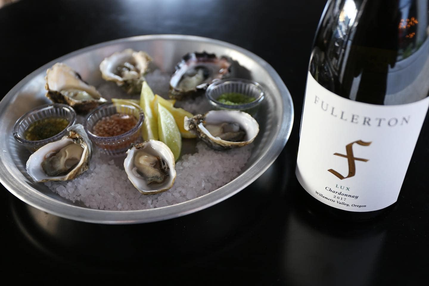 Wine Down Friday with $2 Oysters, Music, and Hygge